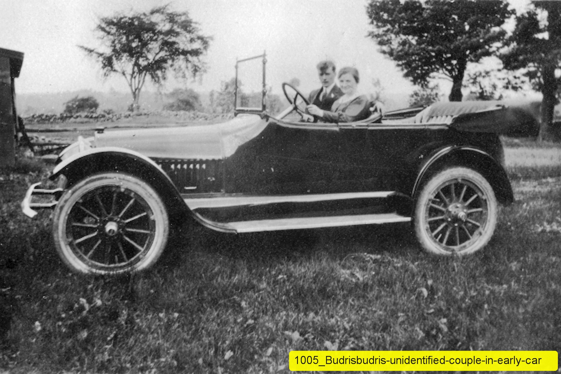 1005_Budrisbudris-unidentified-couple-in-early-car.jpg